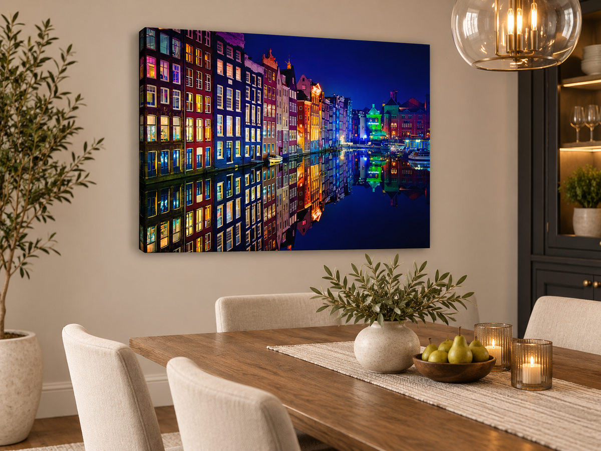 Rows of narrow Amsterdam canal houses glow in red, yellow and blue beside still water — additional artwork view 3