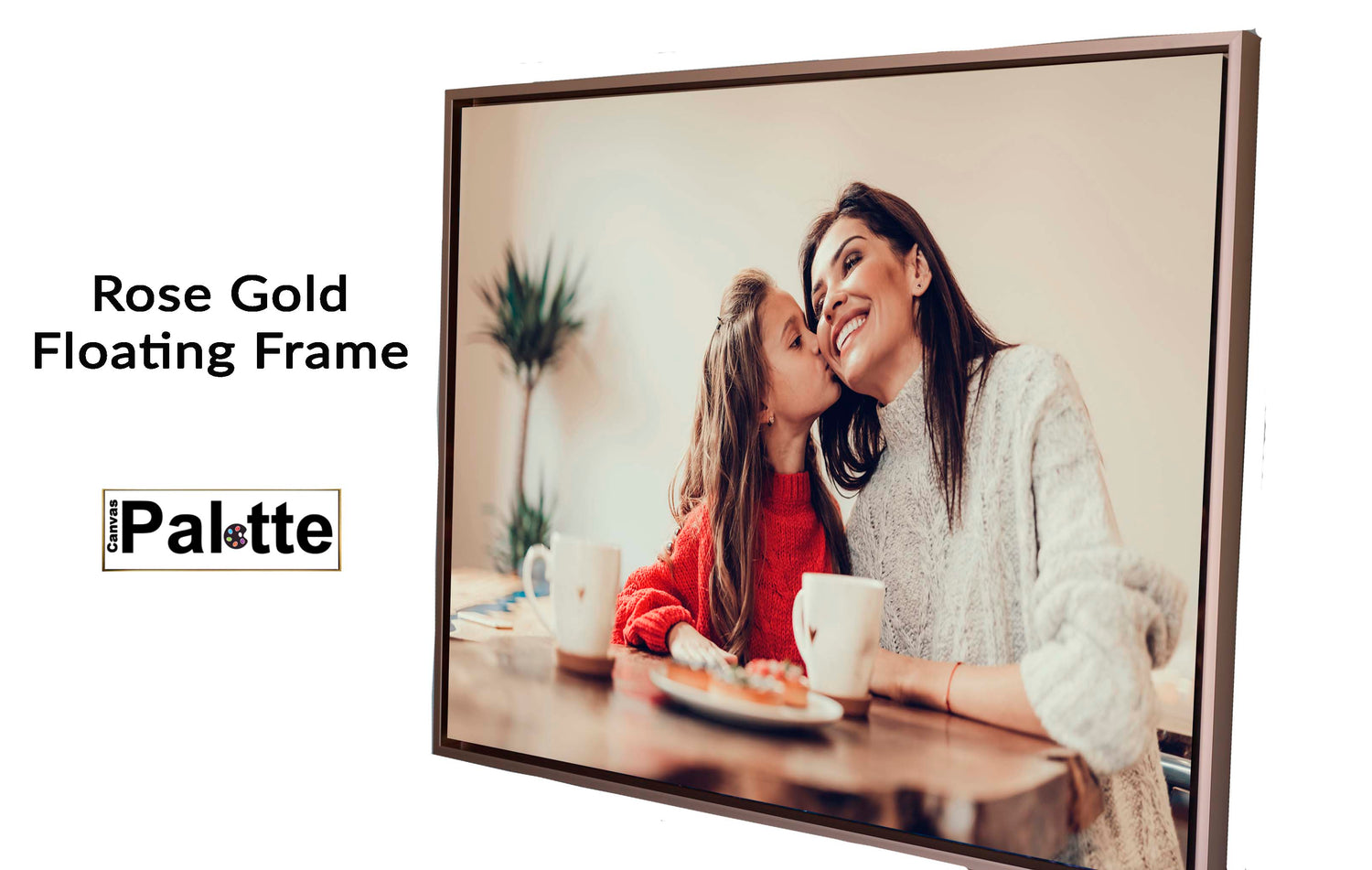 CanvasPalette.com  example of a rose gold, floating sideframe for canvas framing a landscape photo of a mother receiving a kiss from her daughter, both sitting in the dining room.