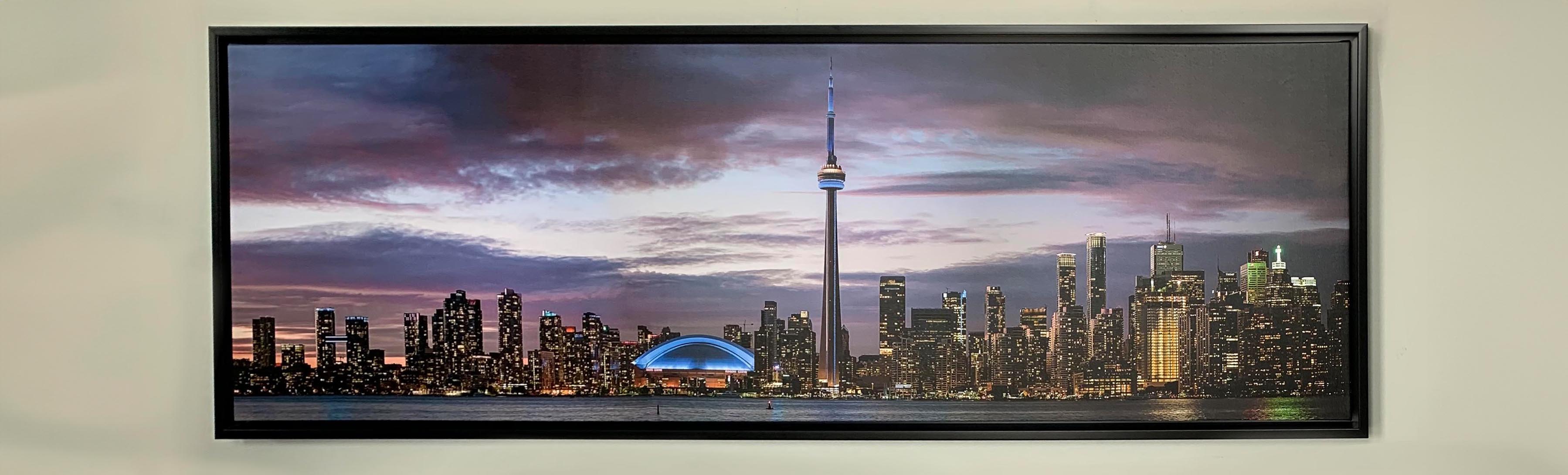 A framed  canvas of the Toronto Skyline . 