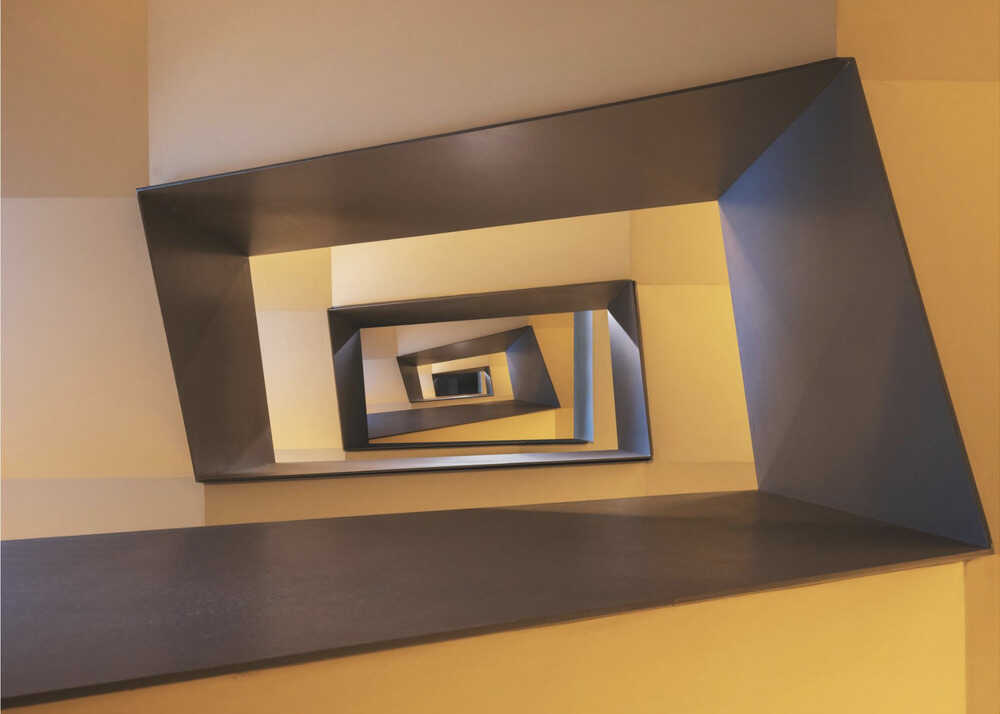 Wall art Several geometric forms in shades from yellow to brown of a staircase in Frankfurt